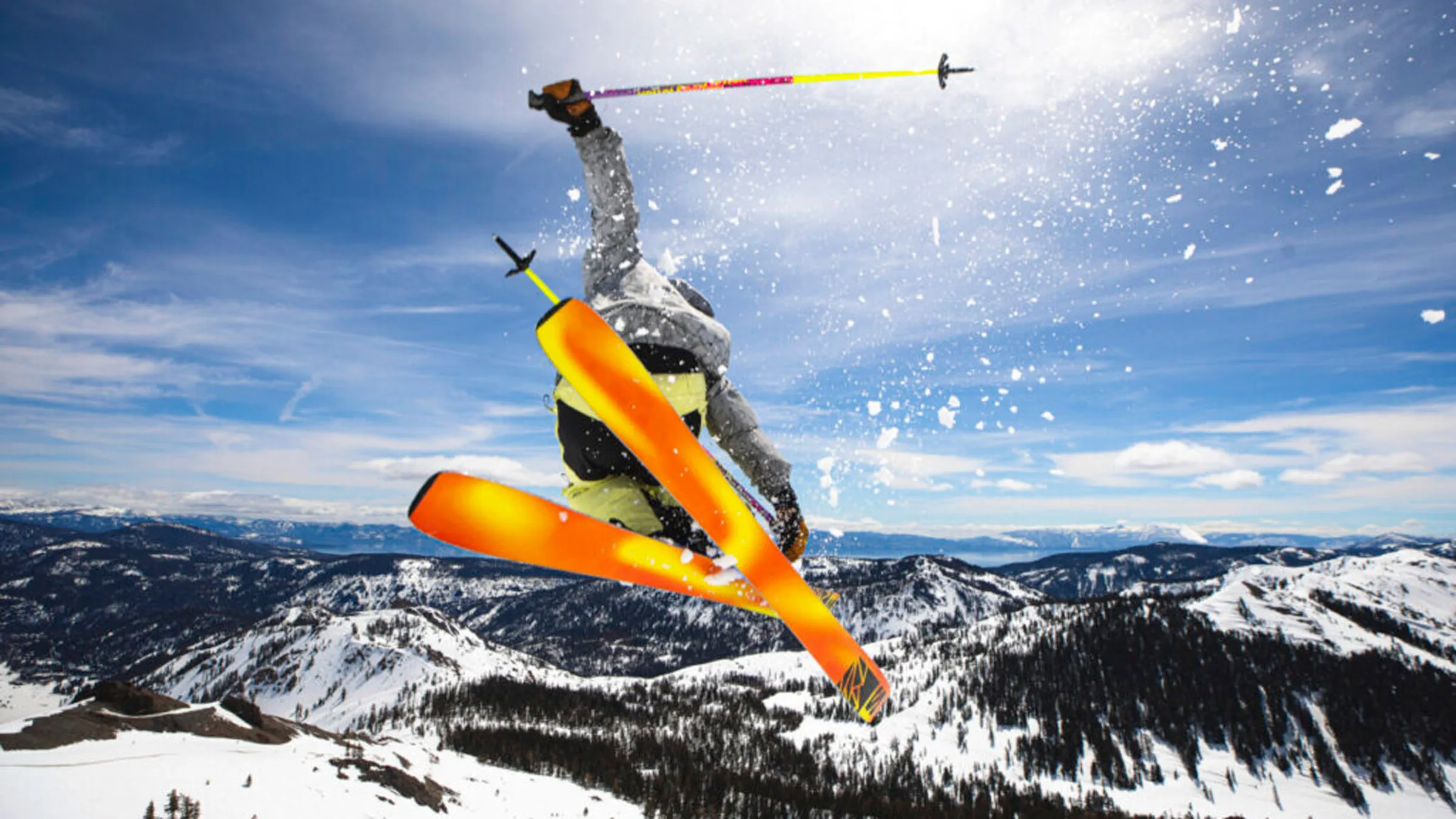Skier getting air off a snow feature during a spring day.